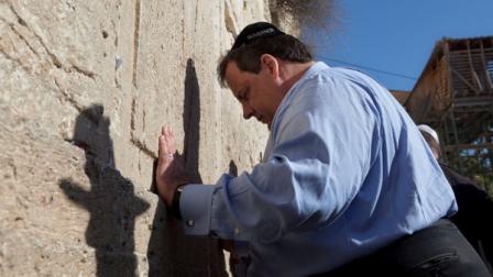 New Jersey Gov. Chris Christie touches the stones of the Western Wall, the holiest site where Jews can pray, during his visit to Jerusalems old city, Monday, April 2, 2012. Christie kicked off his first official overseas trip Monday meeting Israels leader in a visit that may boost the rising Republican stars foreign policy credentials ahead of Novembers presidential election.
