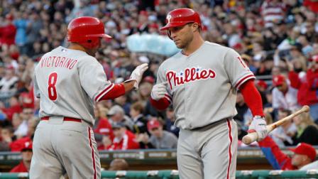 Philadelphia Phillies Shane Victorino (8) is greeted by on-deck batter Philadelphia Phillies Laynce Nix (19) after scoring in the first inning of the baseball game against the Pittsburgh Pirates, Saturday, April 7, 2012, in Pittsburgh. (AP Photo/Keith Srakocic)