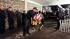 Firefighters and police officers transfer the...