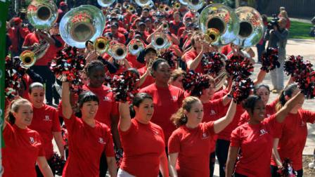 The Rutgers University Marching Band marches through the Voorhees Mall at Rutgers Universitys College Avenue Campus during Rutgers Day celebrations in New Brunswick, N.J., Saturday, April 28, 2012. Celebrations included activities, interactive demonstrations and performances throughout the day on every campus. (AP Photo/Mel Evans)