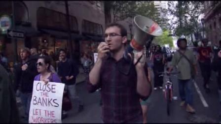 More than 100 Occupy Philadelphia protesters joined the worldwide May Day demonstrations by marching and rallying outside a downtown bank on May 1, 2012.