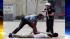 A Los Angeles police officer holds a shotgun on...