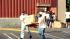 Looters carry a television from a Fedco store at...