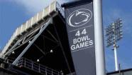 A banner celebrating the 44 bowl games that the Penn State football team has played in hangs outside of Beaver Stadium on the Penn State University main campus in State College, Pa., Monday, July 23, 2012. (AP Photo/Gene J. Puskar)