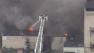 Crews battling 2-alarm garage fire in Kensington