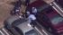 Police say a fleeing bank robber crashed his...