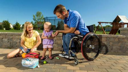 In this photo taken Aug. 6, 2012, Brenda and Chuck Isaacson play in their back yard with their 16-month old daughter, in Sun Prairie, Wis. A bill being considered in the Senate would expand the VAs medical benefits package so other veterans, and their spouses or surrogates, dont have to bear the same expense. The department currently covers a range of medical treatment for veterans, including some infertility care, but the legislation would authorize the VA to cover the cost of IVF and to pay for procedures now covered for some critically injured active-duty soldiers. (AP Photo/Andy Manis)