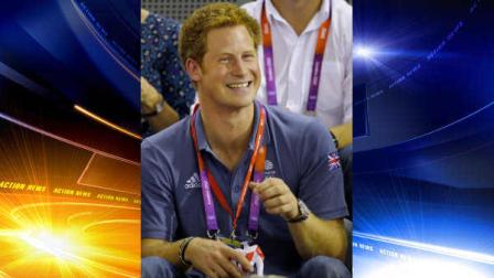 FILE- Britains Prince Harry watches track cycling during the 2012 Summer Olympics, in this file photo dated Thursday, Aug. 2, 2012, in London. Nude photographs of Prince Harry in a Las Vegas, USA, hotel room are published on the Internet Wednesday Aug. 22, 2012, and now security experts are wondering whether the Scotland Yard officers who are assigned to keep the 27-year-old royal safe from harm, might have done a better job of keeping him out of trouble. The photos available on the Internet and not taken by Photographers long lenses but are up close and personal. (AP Photo/Matt Rourke, File)