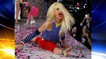 Designer Betsey Johnson goes into a split after doing a cartwheel on the runway after the Betsey Johnson Spring 2013 collection show during Fashion Week, Tuesday, Sept. 11, 2012, in New York. (AP Photo/Jason DeCrow)