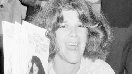 FILE - In this Sept. 27, 1983 file photo, actress and comedienne Gilda Radner holds up copies of her book, Roseanne Roseannadannas Hey, Get Back To Work, at a New York bookstore. The Madison, Wis.-area chapter of Gildas Club is the latest to change its name to the Cancer Support Community, a move its director said was necessary because young people dont know who Radner was. (AP Photo/Suzanne Vlamis)