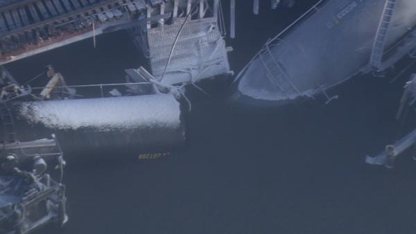 Train carrying chemicals derails into Del. River