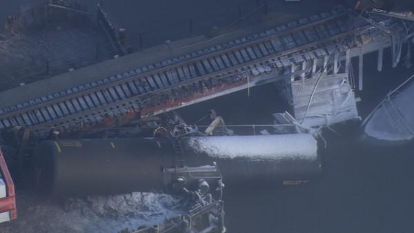 Train carrying chemicals derails into Del. River