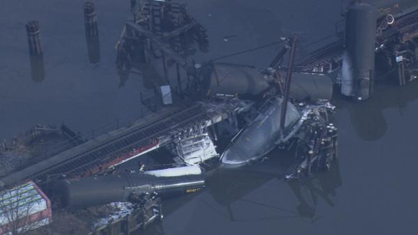 Train carrying chemicals derails into Del. River
