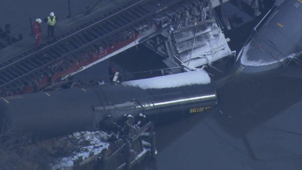 Train carrying chemicals derails into Del. River