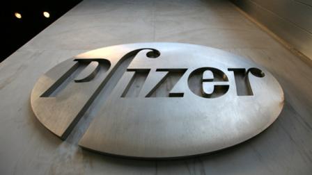 A sign at Pfizer world headquarters is shown Sunday, Jan. 25, 2009 in New York. Pfizer Inc. says its fourth-quarter profit plunged 90 percent on a hefty legal settlement for investigations into the companys marketing practices. The earnings report Monday came as the worlds biggest drugmaker announced it is buying rival drugmaker Wyeth for $68 billion in cash and stock.(AP Photo/Mark Lennihan)