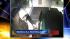 Surveillance images show one man installing the...
