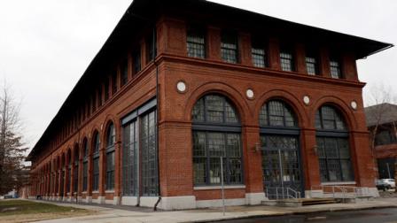 In this Wednesday, Feb. 6, 2013 photo, shown is the Urban Outfitters building at the Navy Yard in Philadelphia. The citys Navy Yard is celebrating a milestone that skeptics might not have believed 15 years ago. Nearly all naval operations are long gone from the sprawling former shipyard but 10,000 people now work there in an eclectic mix of businesses from fashion to pharmacies. That number is expected to triple in 20 years.