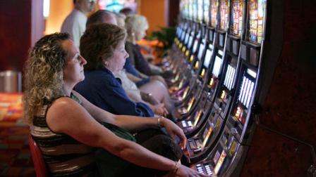 People play slot machines at Philadelphia Park Casino and Racetrack Monday, June 25, 2007, in Bensalem, Penn. As declining attendance and revenues threaten the existence of the horse racing industry in New Jersey and elsewhere, patrons are flocking to tracks around the country _ but drawn less by the prospect of poring over a Racing Form than by the lure of striking it rich by pulling a lever or pushing a button. (AP Photo/Mel Evans)