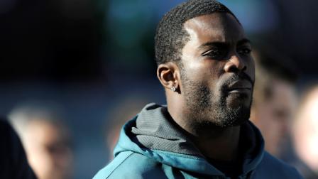 Philadelphia Eagles quarterback Michael Vick watches the game from the bench in the first half of an NFL football game against the Washington Redskins, Sunday, Dec. 23, 2012, in Philadelphia. (AP Photo/Michael Perez)