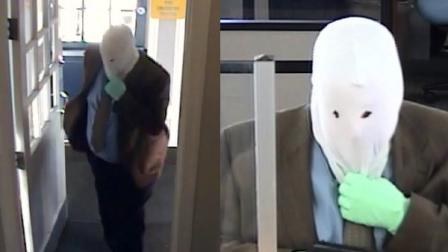 Pictured is an armed masked man who robbed a PNC Bank branch in Ambler, Montgomery County on Saturday March 30, 2013.
