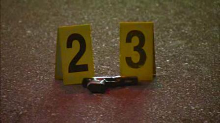 Evidence markers sit next to a pistol following a deadly police-involved shooting along Arrott Street in Northeast Philadelphia Sunday night.