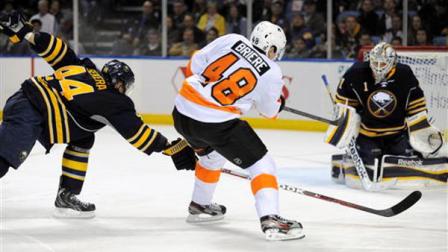 Buffalo Sabres defenseman Andrej Sekera (44), of Slovakia, lays his stick out trying to block the shot by Philadelphia Flyers right winger Danny Briere (48) as he shoots the puck at Sabres goaltender Jhonas Enroth (1) of Sweden, during the second period of an NHL hockey game in Buffalo, N.Y., Saturday, April 13, 2013. (AP Photo/Gary Wiepert)