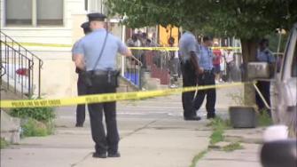 Authorities on the scene of a police involved shooting in West Philadelphia on May 22, 2013.