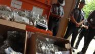 May 23, 2013: Pennsylvania State troopers stand near drugs, cash seized in a Montgomery County drug bust.