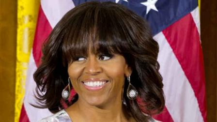 First lady Michelle Obama arrives at an event in honor of military mothers in the East Room of the White House in Washington, Thursday, May 9, 2013. (AP Photo/Jacquelyn Martin).