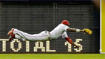 Philadelphia Phillies left fielder Domonic Brown cant reach a double off the bat of San Diego Padres Pedro Ciriaco in the ninth inning of a baseball game in San Diego, Tuesday, June 25, 2013. Despite the double, the Phillies won the game 6-3. (AP Photo/Lenny Ignelzi)