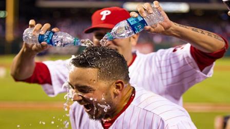 Philadelphia Phillies Freddy Galvis gets doused with water by Mike Adams following the ninth inning of a baseball game against the Atlanta Braves, Saturday, Sept. 7, 2013, in Philadelphia. The Phillies win 6-5. (AP Photo/Chris Szagola)