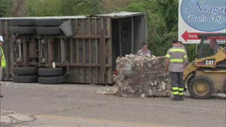 Trash truck overturns in Bristol