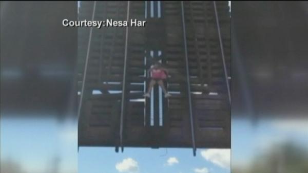 Charity walker trapped by raised bridge