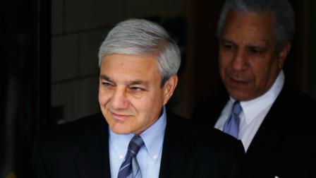 Former Penn State president Graham Spanier, left, exits the Dauphin County Courthouse, Monday, July 29, 2013, in Harrisburg, Pa. (AP Photo/Matt Rourke)