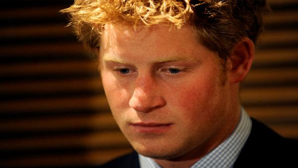 Britains Prince Harry listens as his brother Prince William (not pictured) delivers a speech in west London Thursday Jan. 8, 2009. A British newspaper says it has video footage of Prince Harry allegedly using offensive and racist language. The Sunday tabloid The News of The World reported that Harry, third in line to the British throne, used offensive terms to refer to people from Pakistani and people of Arab descent. Britains St. Jamess Palace _ the office of Harry and his elder brother Prince William _ said on Saturday that Harry was sorry for any offense caused. The newspaper said the video was recorded three years ago. It alleged he called one person a paki and referred to others as ragheads. (AP Photo/Toby Melville, pool)