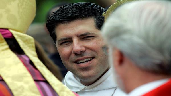 Rev. Alberto Cutie participates in a blessing of the crosses outside the Episcopal Church of The Resurrection Sunday, May 31, 2009 in Biscayne Park, Fla. Cutie, a popular Miami priest nicknamed Father Oprah said Sunday that church is about forgiveness during his first sermon since leaving the Roman Catholic Church after photographs surfaced of him kissing his girlfriend on the beach. (AP Photo/Wilfredo Lee)