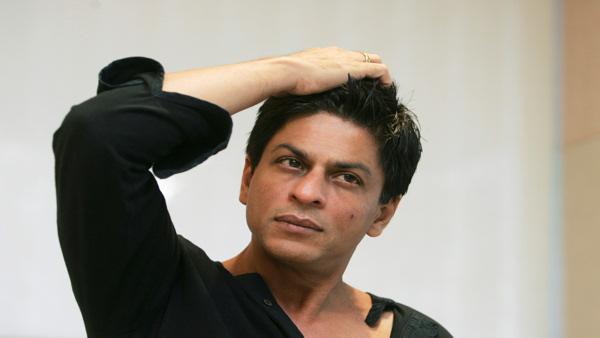 FILE - In this Dec. 8, 2008 file photograph, Bollywood actor Shah Rukh Khan gestures during an interview with The Associated Press at his residence in Mumbai, India. Khan was detained for questioning at Newark international airport and grilled for two hours before being let off by U.S. immigration authorities, a news agency report said Saturday. (AP Photo/Gautam Singh, File)