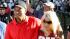 Tiger Woods celebrates with wife Elin Nordegren...