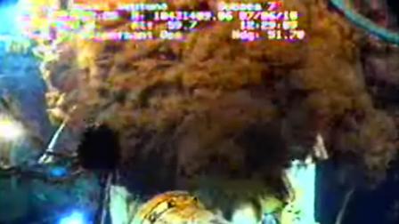 This image from video provided by BP PLC Monday, June 7, 2010 shows the oil leak out of the well head around the capping device in the Gulf of Mexico.