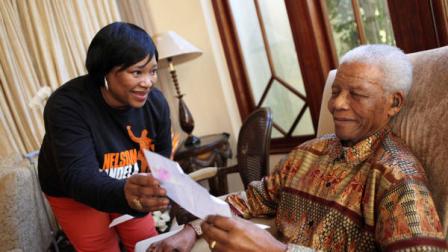 In this photo supplied by the Nelson Mandela Foundation, former South African president Nelson Mandela sits with his youngest daughter Zindzi, at his home in Johannesburg Saturday July 17, 2010. (AP Photo/Debbie Yazbek-Nelson Mandela Foundation)