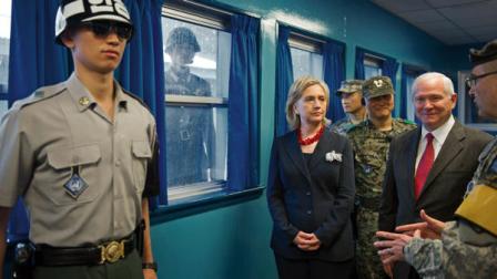 U.S. Army Col. Kurt Taylor, right, briefs U.S. Secretary of State Hillary Rodham Clinton, center, and U.S. Secretary of Defense Robert Gates, 2nd right, at the truce village of Panmunjom in the demilitarized zone (DMZ) that separates the two Koreas since the Korean War, north of Seoul, South Korea Wednesday, July 21, 2010, in Seoul, South Korea. (AP Photo/Paul J. Richards, Pool)