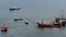 Vessels assisting in the capping of the Deepwater Horizon oil wellhead are seen on the Gulf of Mexico near the coast of Louisiana Sunday, July 18, 2010. (AP Photo/Patrick Semansky)
