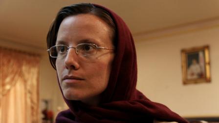 American hiker Sarah Shourd, 32, waits at Mehrabad airport, prior to leaving Tehran, Iran, Tuesday, Sept. 14, 2010. An American woman released by Iran on Tuesday after more than a year in prison flew out of the country to the nearby Gulf nation of Oman to be reunited with her mother after a $500,000 bail was paid to win her freedom.