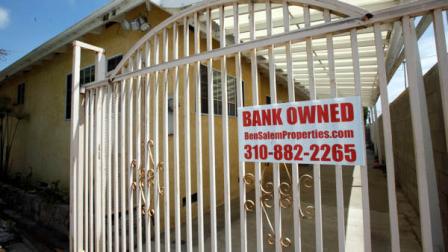 A bank owned sign is seen on a home that is listed as a foreclosure on a HUD website, in Hawthorne, Calif., Wednesday, July 21, 2010.