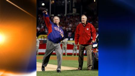 Former Presidents George Bush, right, watches his son, George W. Bush throw the ceremonial first pitch for Game 4 of baseballs World Series between the San Francisco Giants and the Texas Rangers Sunday, Oct. 31, 2010, in Arlington, Texas. (AP Photo/Matt Slocum)