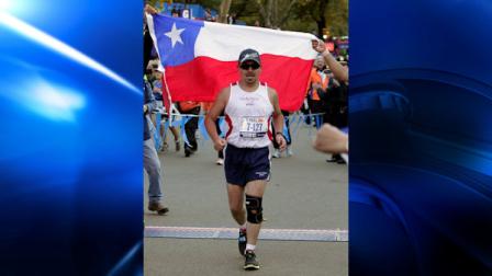 Chilean miner Edison Pena carries a Chilean flag at the finish of the New York City Marathon in New York, Sunday, Nov. 7, 2010. (AP Photo/Kathy Willens)