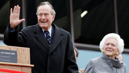 FILE - In this Dec. 7, 2009 file photo, former President George H.W. Bush and former first lady Barbara Bush arrive for a ceremony to dedicate an expanded gallery that carries his name at the National Museum of the Pacific War, in Fredericksburg, Texas. On Wednesday, President Barack Obama named the former president a recipient of the Presidential Medal of Freedom