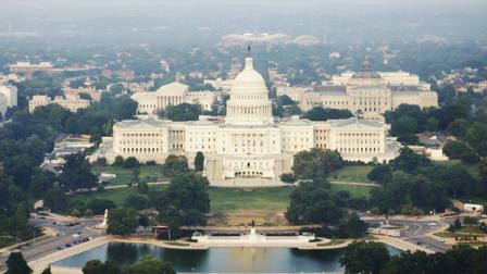 The United States Capitol, center, the Capitol Reflecting Pool, foreground, the U.S. Supreme Court, back left of Capitol, the Library of Congress Jefferson Building, back right of the Capitol and the RFK Stadium, center background, Wednesday, May 31, 2006, in Washington. (AP Photo/Manuel Balce Ceneta)