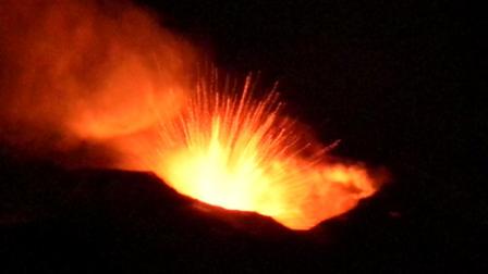 This image provided by the Italian National Institute of Geophysics and Volcanology shows a strombolian explosion from the active pit crater on the east flank of the Southeast Crater cone of Mount Etna Wednesday evening of Jan. 12, 2011 as seen from Piano del Vescovo, at 1375 m elevation on the southeast flank of Etna.