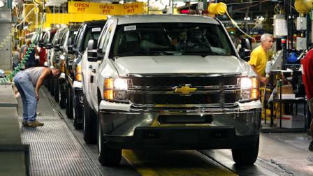 FILE - In this June 23, 2010 file photo, 2011 Chevrolet Silverados await final inspection at the Flint Assembly in Flint, Mich. (AP Photo/Carlos Osorio, File)